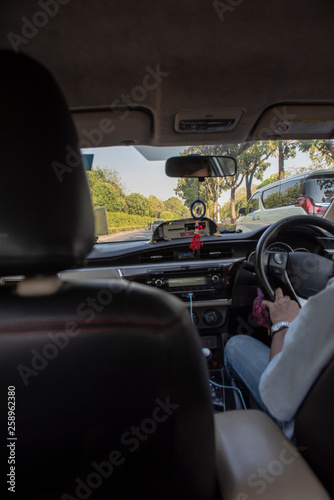 Taxi driver in a busy traffic day in Bangkok, Thailand.