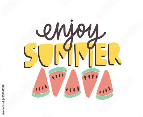Enjoy Summer phrase handwritten with calligraphic font and decorated by watermelon slices