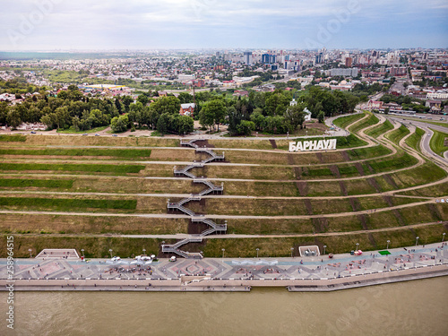 Barnaul, Russia. Description of Barnaul at the entrance to the city. Highland Park and a new embankment is the top view in summer. photo