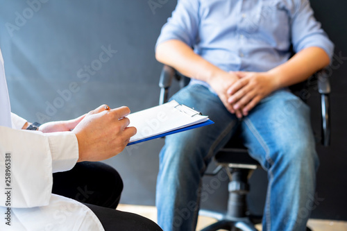 Male doctor and prostate cancer patient are discussing about prostate cancer test report. Diagnostic  prevention of men diseases  healthcare  medical service  consultation  healthy lifestyle concept.