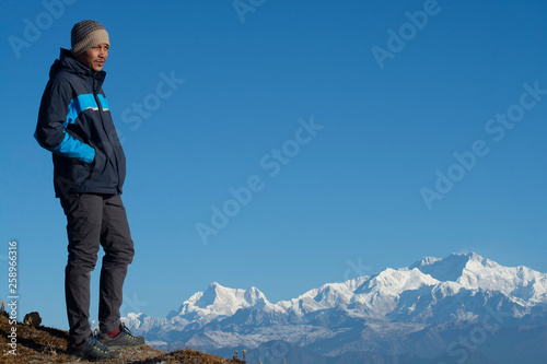 Man standing looking at nature view, it has been taken at Singalila National Park, India photo