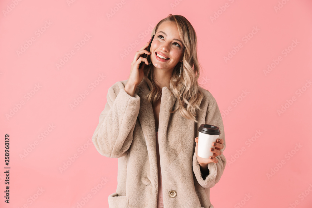 Beautiful young blonde woman wearing winter fur coat Beautiful young blonde woman wearing winter fur coat