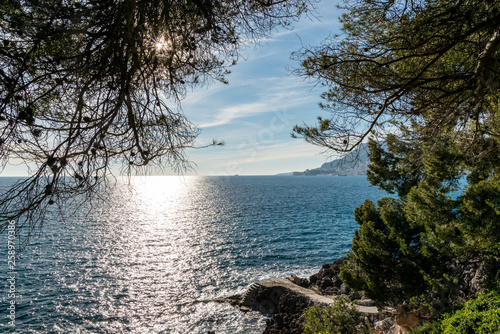 Sunlight reflected on the sea of Cap Martin in a sunny winter day