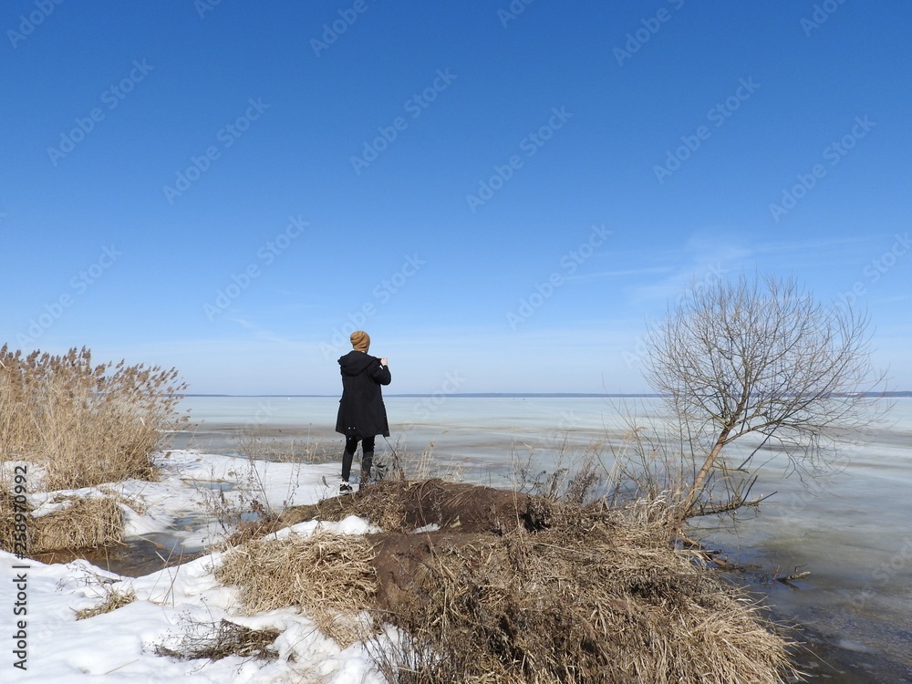 The man from behind, photographed in winter, the frozen lake Pleshcheyevo, Yaroslavl oblast, Pereslavl Zalessky.