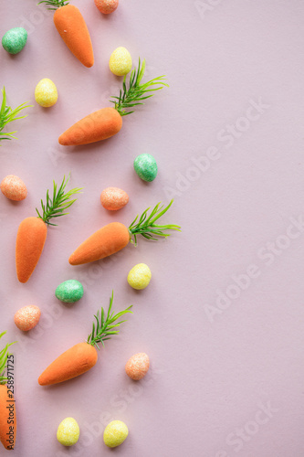 Easter lay flat composition with easter eggs and carrots