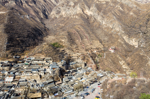 Chuandixia, Hebei province, China: panoramic view of this ancient and picturesque Ming Dynasty village nestled among the mountains, not far from Beijing. Guandi temple is visible on the right