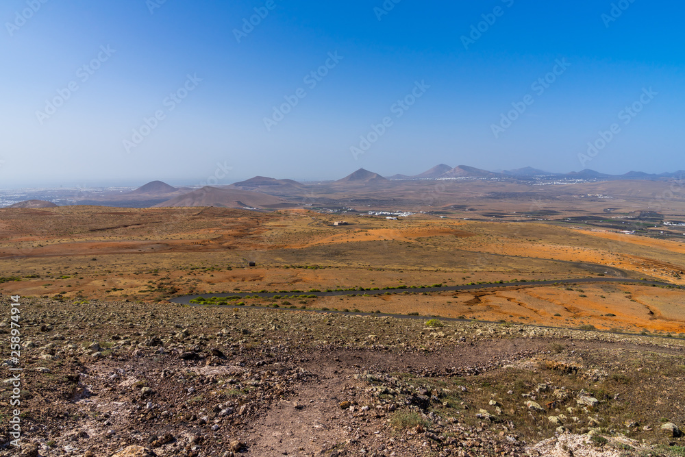 Spain, Lanzarote, Endless view from a mountain over many volcanic mounts