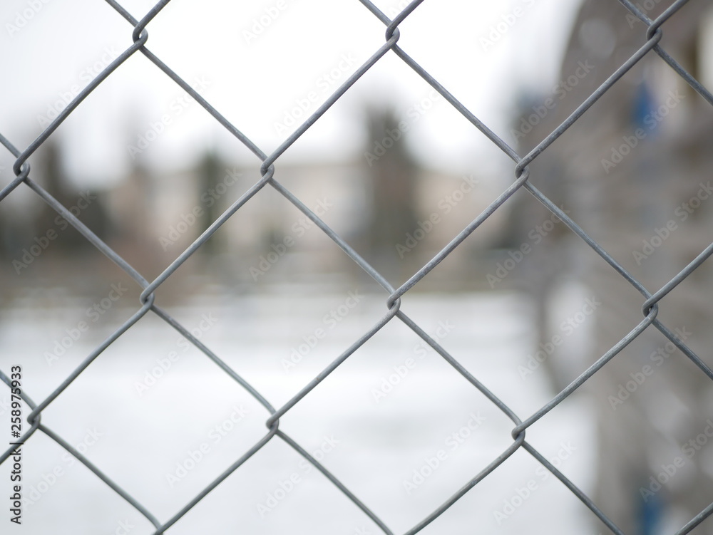 Polonne / Ukraine - 2 February 2019: Fence metal mesh background Polonne / Ukraine - 2 February 2019: Fence metal mesh background