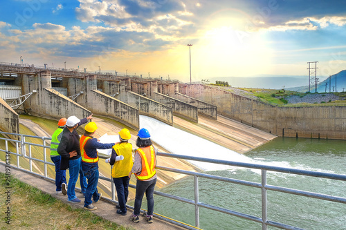 The success of the engineering team together to develop water power in the dam to generate electricity. photo