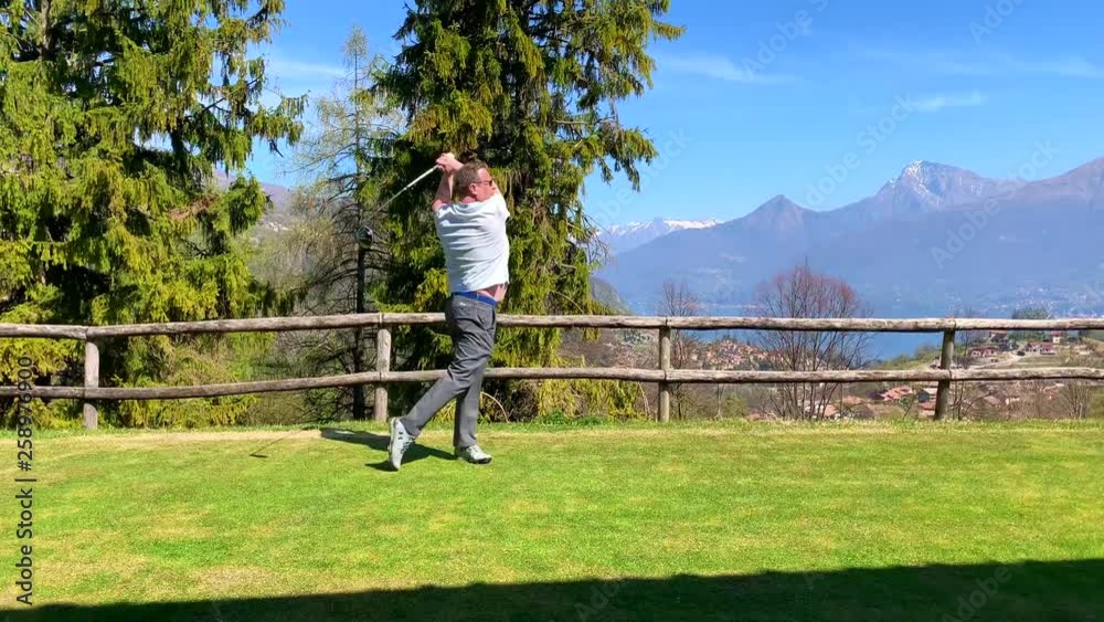 Golfer Warming Up with His Golf Club Driver.