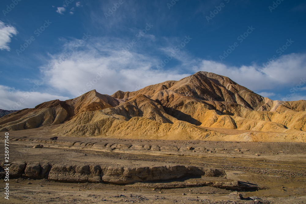 Colored hills of sand and stone in Death Valley National Park. 