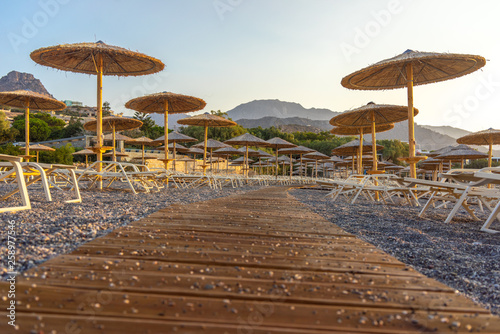 Beach umbrellas from bamboo. One of the cleanest and most beautiful beaches in Crete.