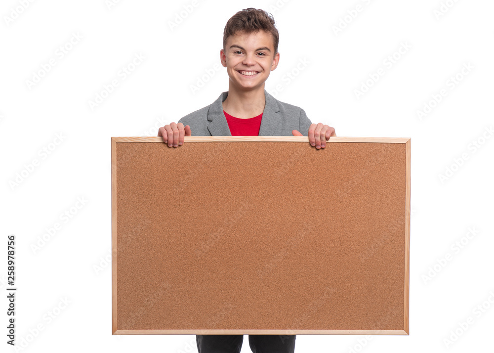 Portrait of young caucasian teen boy holding wooden board. Funny teenager showing empty billboard sign and looking at camera, isolated on white background. Portrait of young caucasian teen boy holding wooden board. Funny teenager showing empty billboard sign and looking at camera, isolated on white background.