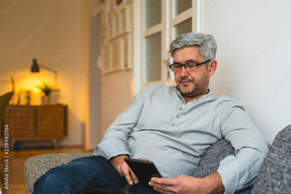 middle aged man using tablet