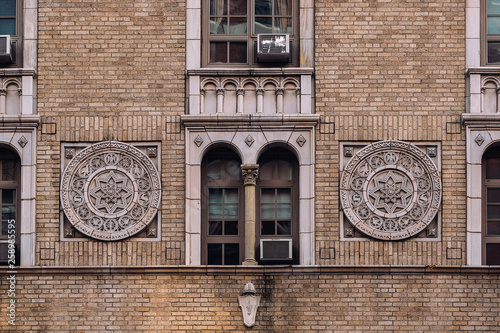 Close view of ornament on the building exterior of 238 W 23rd Street in Chelsea New York City