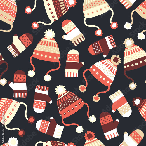 Seamless vector background with hats and mittens. Contemporary seasonal winter pattern tile with knitted winter clothes in red black beige. Cozy handmade knit Winter wear design, Scandinavian style. 