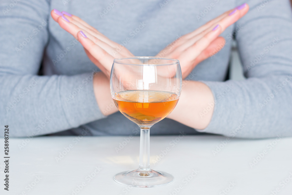 young woman refuses alcohol. stop alcoholism young woman refuses alcohol. stop alcoholism