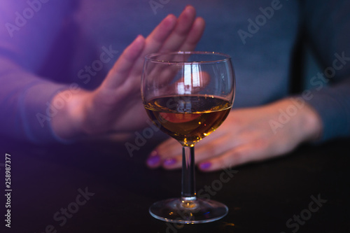 young woman refuses alcohol