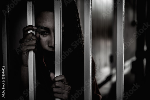 Hands of women desperate to catch the iron prison,prisoner concept,thailand people,Hope to be free.