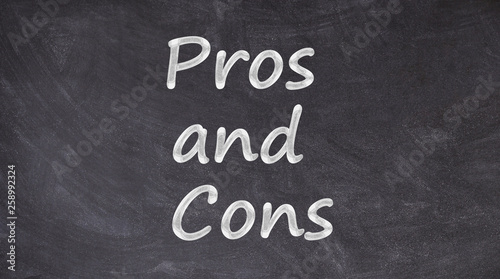 Pros and Cons written on blackboard