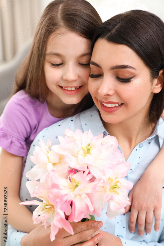 Little daughter congratulating her mom, closeup. Happy Mother's Day Little daughter congratulating her mom, closeup. Happy Mother's Day