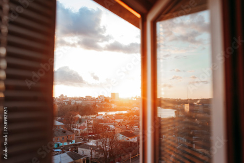 Bright evening sun in the open window