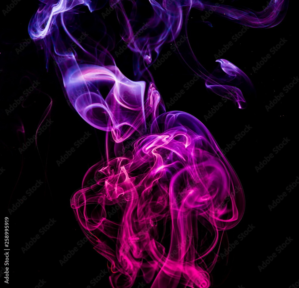 Obraz premium Colored smoke on black background