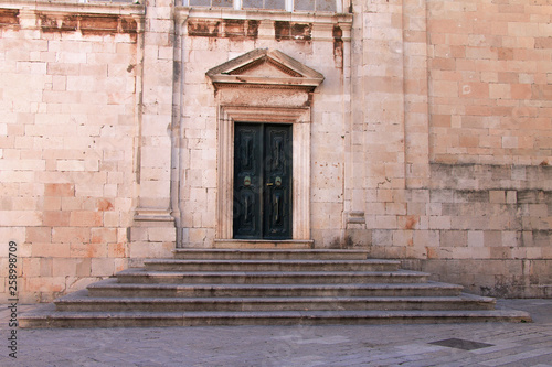 Old door on church in Dubrovnik , Croatia © Ellica