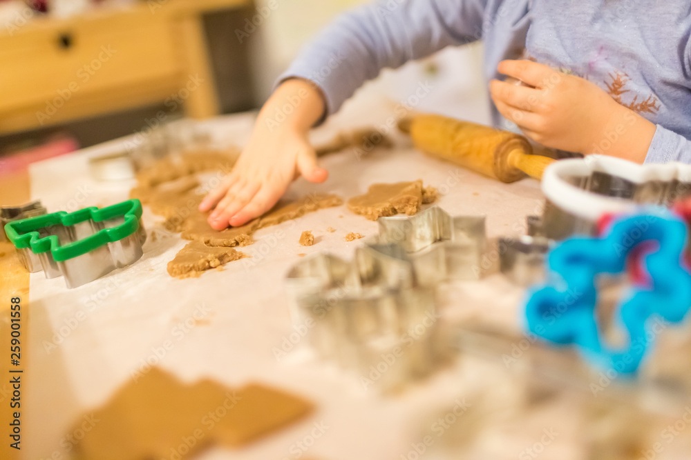 Baking with the family - Mother and daughter making self made cookies in a home kitchen Baking with the family - Mother and daughter making self made cookies in a home kitchen