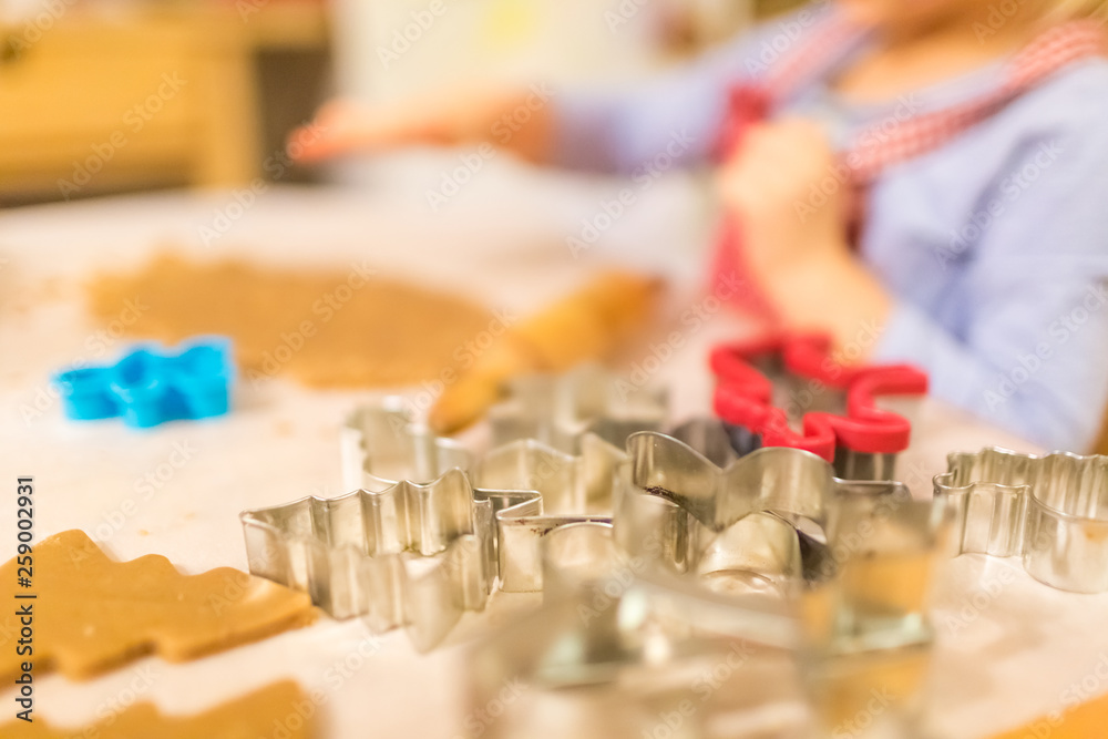 Baking with the family - Mother and daughter making self made cookies in a home kitchen
