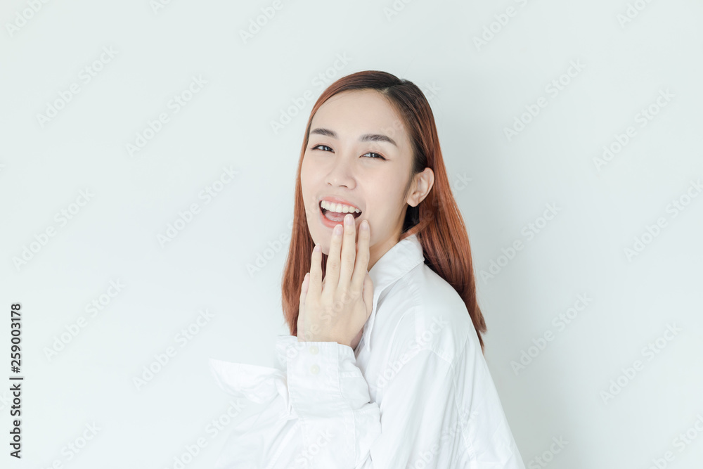 Beautiful cute happy Asian woman smile and look to camera in studio
