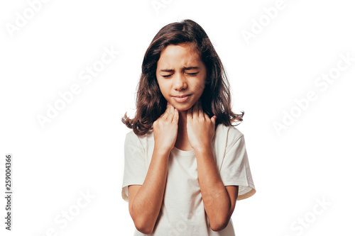 Portrait of young girl suffering from sore throat