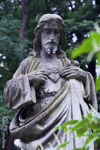 Ancient statue of Jesus Christ. Faith, religion, immortality concept.