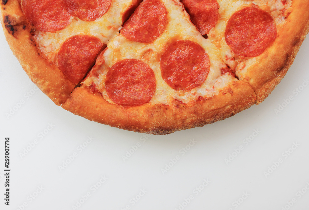 Pepperoni pizza slices isolated on white background close up top view. Traditional classic hot italian pizza with pepperoni and cheese ingredients. Tasty fresh pepperoni pizza on plate for lunch Pepperoni pizza slices isolated on white background close up top view. Traditional classic hot italian pizza with pepperoni and cheese ingredients. Tasty fresh pepperoni pizza on plate for lunch