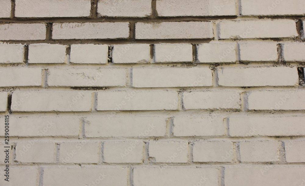 Brick wall texture background of grungy aged white brickwork pattern. Stone material surface close up view of rustic weathered textured brickwall Brick wall texture background of grungy aged white brickwork pattern. Stone material surface close up view of rustic weathered textured brickwall