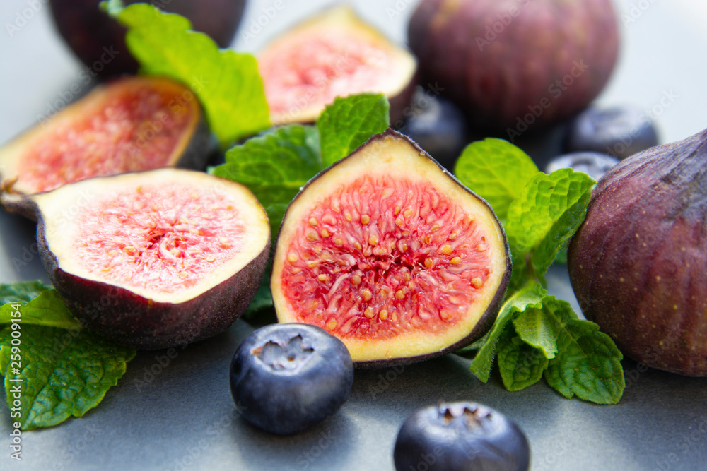 Fresh figs with mint and blueberries. Beautifulf berry, fruit