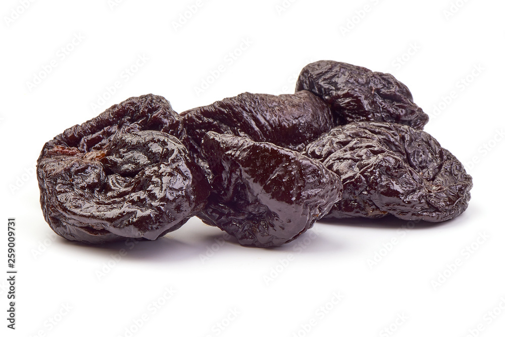 Dried plums fruits, tasty prunes, close-up, isolated on white background Dried plums fruits, tasty prunes, close-up, isolated on white background