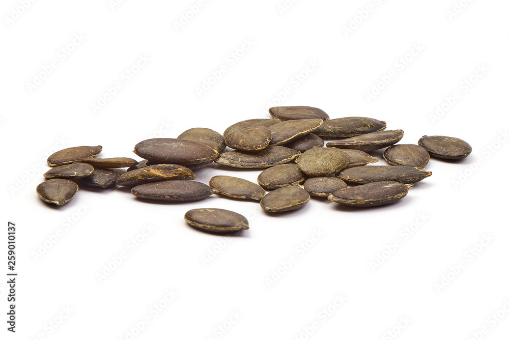 Stack of Black Melon Seeds, close-up, isolated on white background Stack of Black Melon Seeds, close-up, isolated on white background