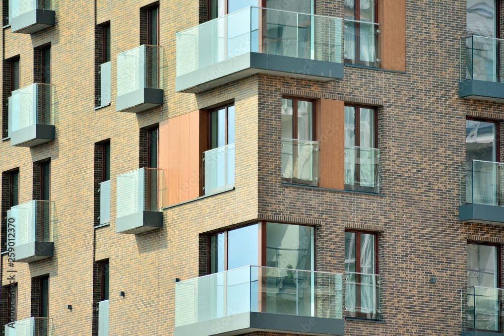 Fototapeta premium Fragment of a modern apartment building in front. Very modern apartment house.