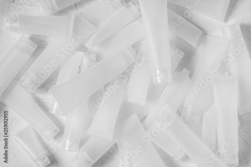 lots of tube of cream or gel white plastic product on white background