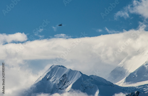 A small bush plane flies over Mount Denali in Alaska. © bettys4240
