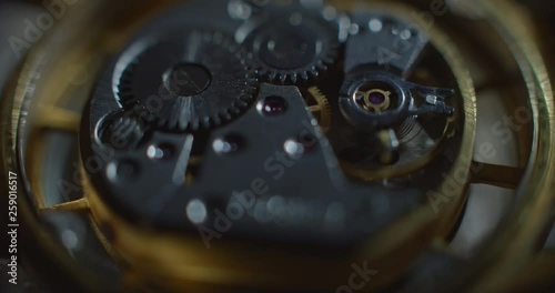 Old clock mechanical part working white lightning from right side static angle view macro ProRes 4444