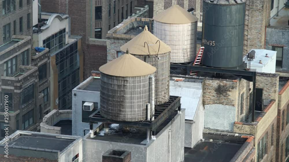 Historic and still used wooden rooftop water tanks in midtown Manhattan NYC.mov Stock Video