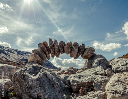 stone sculpture in the swiss alps. The theme is longevity, cohesion and trust.