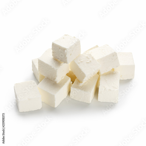 Feta cheese cubes on white
