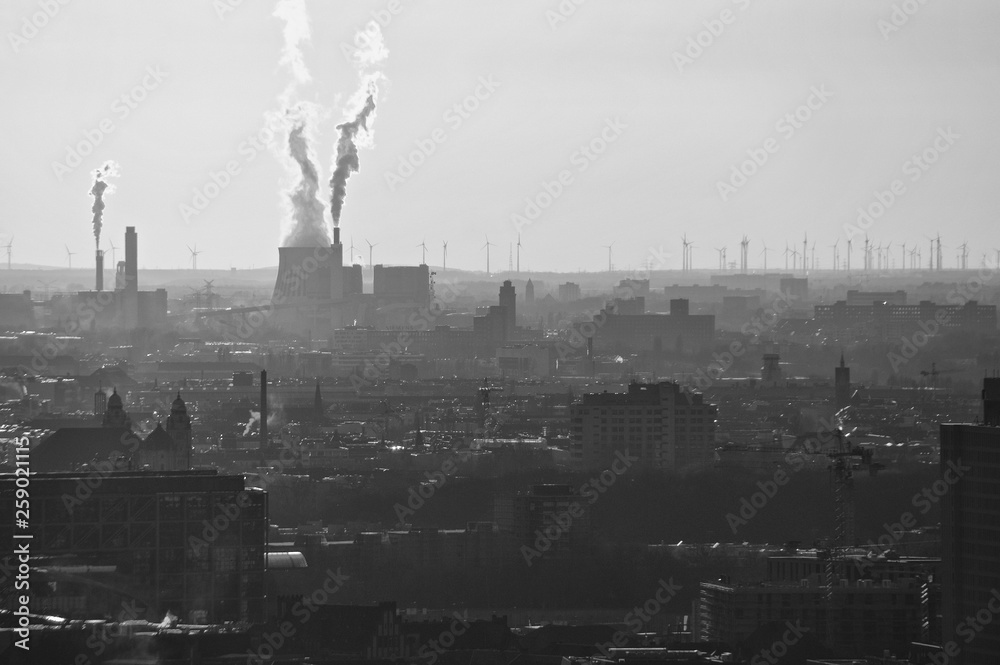 Environmental disaster: chimneys are letting out exhaust gases and carbon dioxide (Berlin 2018)