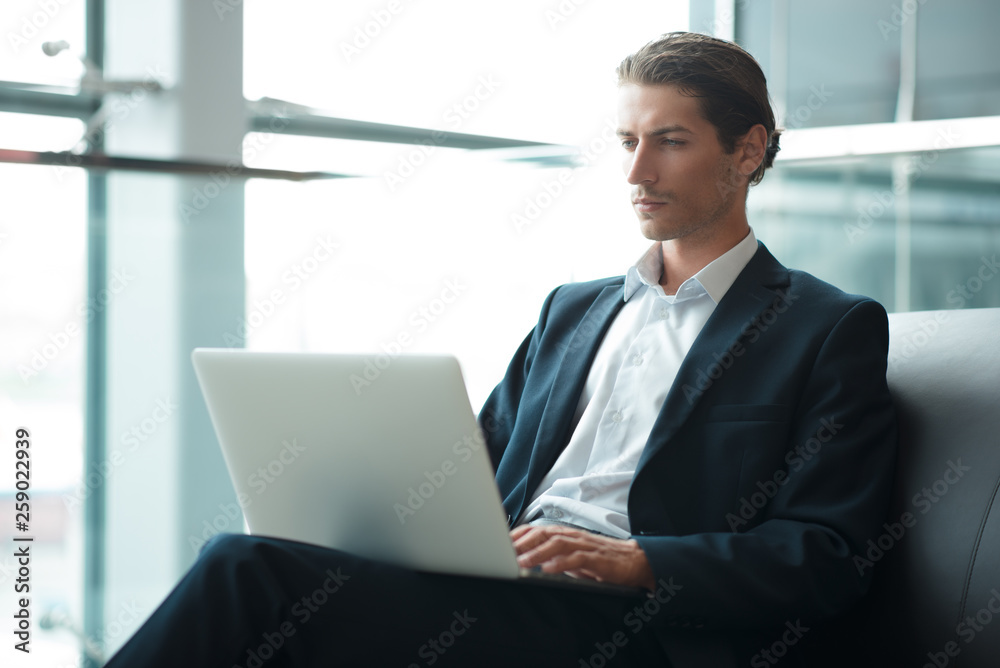 Adult serious man has business conversations using on-line mobile application. Developer innovational business web applications in the internet. Stylish guy. Business portrait. Cloud technologies. Adult serious man has business conversations using on-line mobile application. Developer innovational business web applications in the internet. Stylish guy. Business portrait. Cloud technologies.