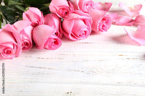 Bouquet of roses on a wooden background