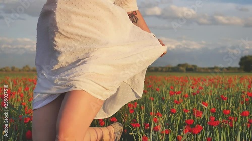 Footage of newlyweds funny couple running through field of flowers