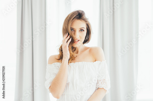 Girl at the curtains. The girl at the window. Gentle image of a girl.